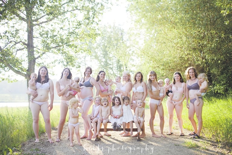 women pose for a group portrait in their underwear