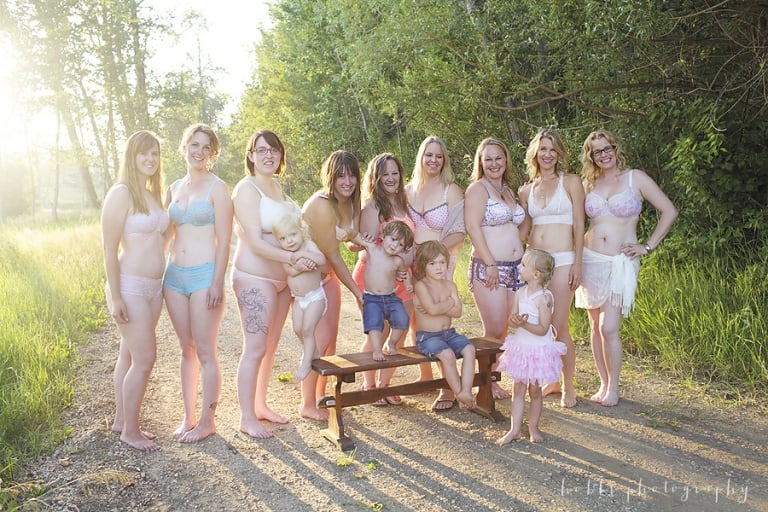 moms of all ages pose together for a mother's beauty group portrait