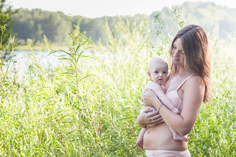 mother and daughter celebrate postpartum beauty in nature