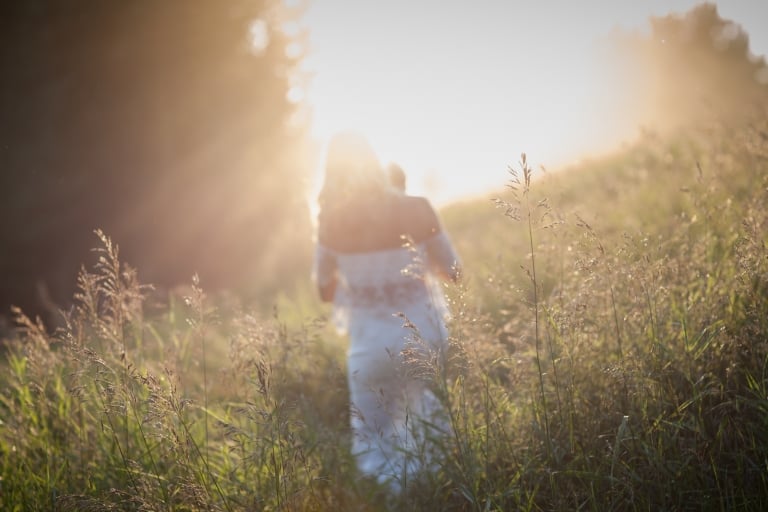 dreamy lifestyle portrait walking in meadow