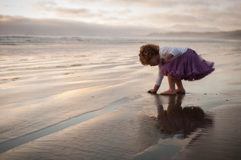 beautiful candid picture of toddler playing on the beach on Vancouver Island