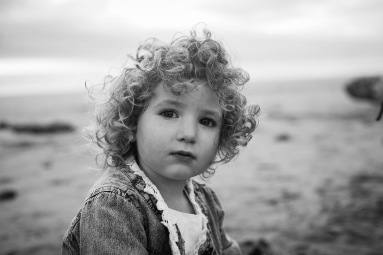 candid photography captures natural portraits of child on Tofino beach