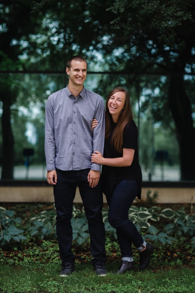 couple laughs during fun engagement session by Edmonton wedding photographers