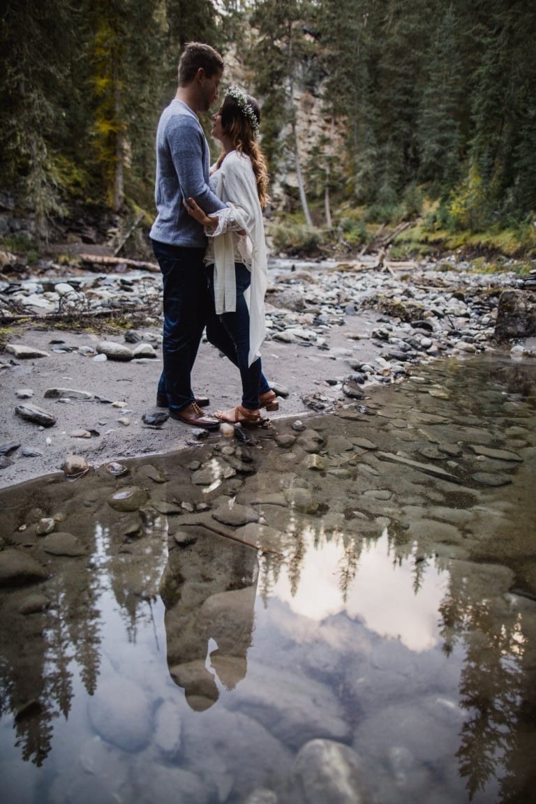 boho couple and their reflection in Banff National Park