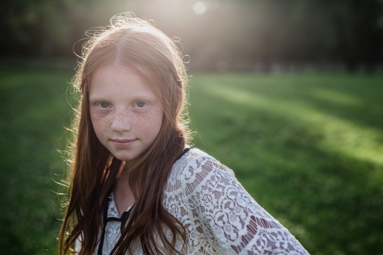 a freckled tween participates in outdoor fall back to school mini sessions for Edmonton kids