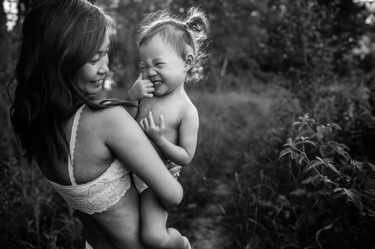 an adorable toddler makes a funny face during a portrait taken by edmonton family photographer