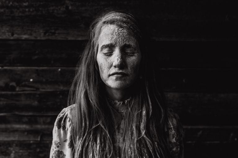 fine art conceptual photo of Jenna Hobbs covered in flour for motherhood photo essay