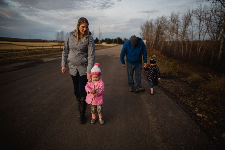 family on road outside Edmonton, Alberta, Canada