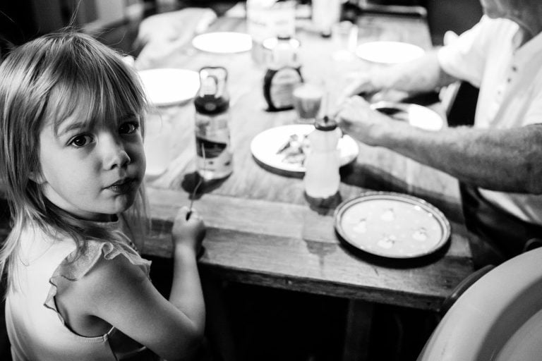 environmental portrait of little girl at the breakfast table