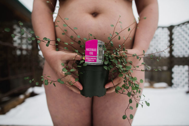 Aimee Hobbs holds Maidenhair Vine plant for World Naked Gardening Day