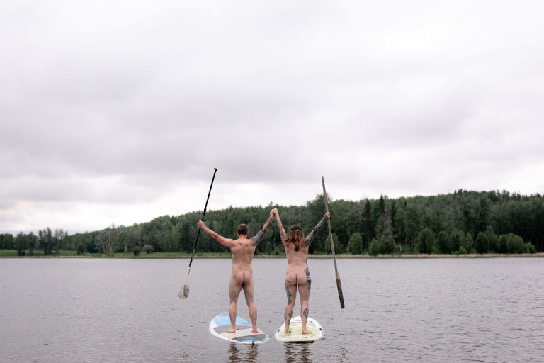 couple goes paddle boarding naked on international skinny dipping day