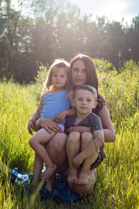 Edmonton yoga teacher Devon Andersen poses with her two children for an outdoor summer portrait